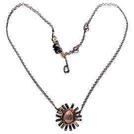 Collar Alexis Bittar de lucite escultural diseño de sol