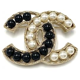 Spilla da donna Chanel in nero, oro e bianco