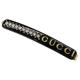 Spilla per capelli in resina nero e oro Gucci