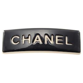 Barrette in plastica bianco e nero Chanel
