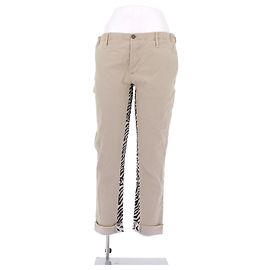 Autre Marque Pantalones beige con estampado animal