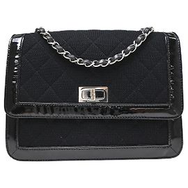 Chanel Reissue Flap Quilted Jersey con Mini Patent