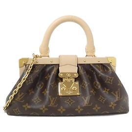 Clutch de lona Monogram Louis Vuitton