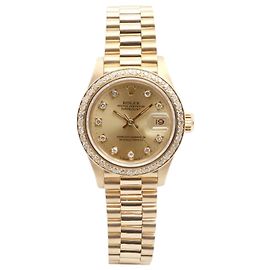 Rolex Datejust Damenuhr aus Gold mit besetzter Lünette