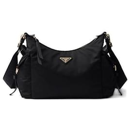 Esplora la borsa grande in nylon e pelle - Prada
