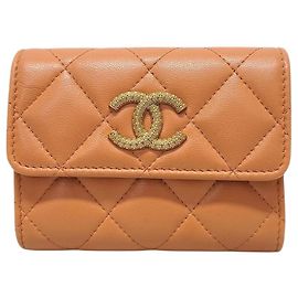 Chanel Tarjetero de piel de cordero naranja y oro con logotipo CC