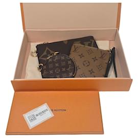 Louis Vuitton Pochette Trio in tela Monogram