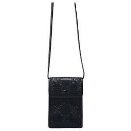 Mini bolsa transversal Gucci GG em relevo