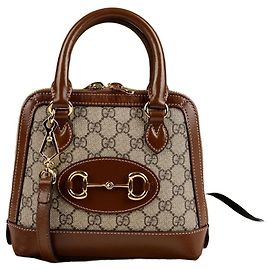 Gucci Mini borsa tote con manico superiore in tela GG Supreme Horsebit