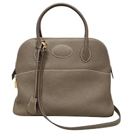Hermès Clemence Bolide in Taupe mit Goldbeschlägen