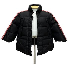 Gucci Chaqueta de plumón de ganso para mujer con paneles GG entrelazados