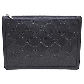 Gucci Clutch da uomo in pelle nera goffrata GG