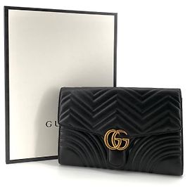 Gucci Clutch con patta trapuntata