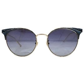 Gucci Lunettes de soleil à monture dorée avec logo GG