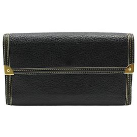 Louis Vuitton Cartera larga Suhali negra Port Tresor en tonos dorados