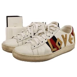 Gucci Sneakers Ace in pelle bianca con ricami Love