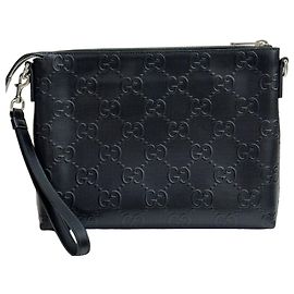 Gucci Pochette in pelle con stampa a rilievo GG Nero