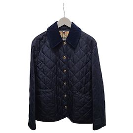 Burberry Chaqueta acolchada con patrón de diamante y cuello de pana azul noche
