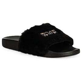 Versace Ciabatte in pelliccia con logo