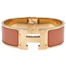Hermès Pulsera con un hermoso color oro rosa y detalles en rosa