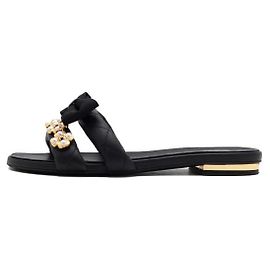 Chanel Schwarze Leder-Mules für Damen mit Schleife und Perlen-Kleeblatt