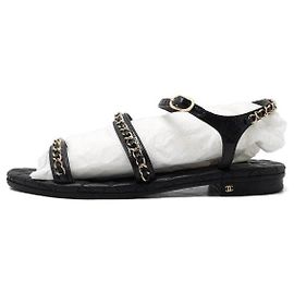 Chanel Sandali neri da donna con cinturino a catena con logo CC dorato