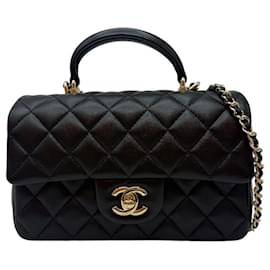 Chanel Nuova Mini Borsa con patta in pelle di agnello con manico superiore Nera
