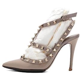 Valentino Zapatos de tacón alto Rockstud en charol rosa