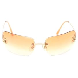Chanel Gafas de sol sin montura con logotipo CC de cristal dorado