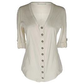 T-shirt in maglia con scollo a V e bottoni anteriori Balmain in cotone beige