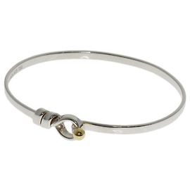 Bracciale con charm Tiffany & Co. in argento e oro giallo 18K