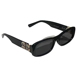 Miu Miu Sonnenbrille Schwarz mit goldenem Logo