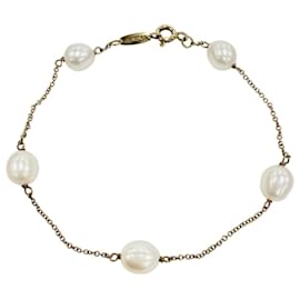 Bracciale charm in oro giallo con perla Tiffany & Co.