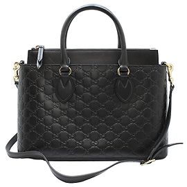 Gucci Borsa a tracolla nera con logo GG in tonalità oro