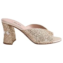 Mule Miu Miu dorate con paillettes