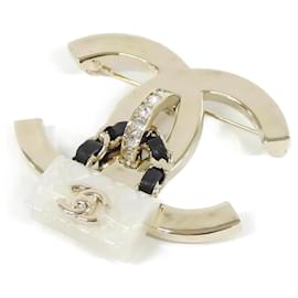 Spilla Chanel ABA011 in pelle nera bianca e oro