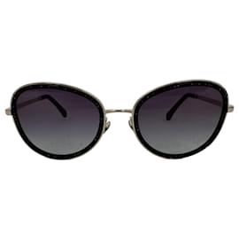 Occhiali rotondi Chanel in metallo nero con cristalli sfumati