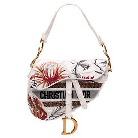 Bolso Saddle Dior de lona blanca con bordados de flores de camuflaje