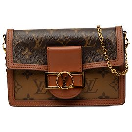Portafoglio con catena Dauphine in Monogram Reverse marrone Louis Vuitton