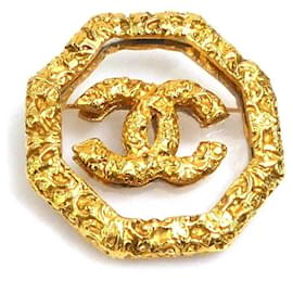 Spilla in metallo dorato Chanel
