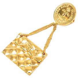 Bolso Chanel Gold CC Bañado en Oro Acolchado con Broche de Medallón