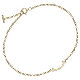 Bracciale T Smile Mini di Tiffany & Co. in oro giallo 18K