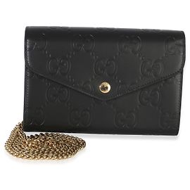 Portafoglio con catena Gucci in pelle di vitello nera con logo GG impresso