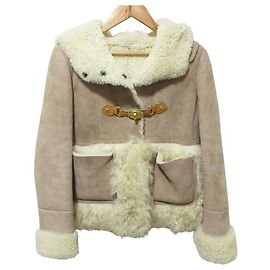 Giacca con cappuccio in shearling Miu Miu