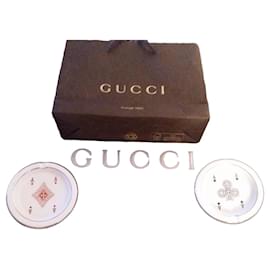 Two Gucci ceramic ashtrays with vintage playing card motif