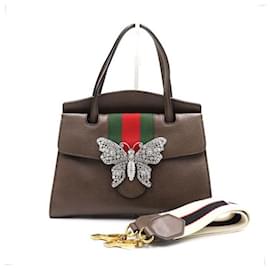 Gucci Braune Leder-Tote-Tasche und Umhängetasche mit Kristallschmetterling, Henkel und Schulterriemen