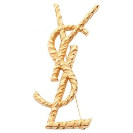 Broche Opium plaquée or Yves Saint Laurent