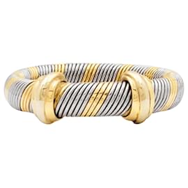Anello Cartier, "Trinity", tre toni d'oro e acciaio.