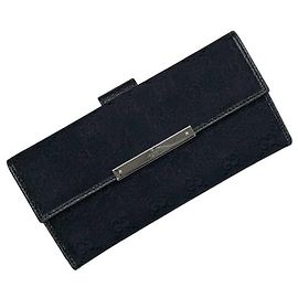 Portafoglio lungo bi-fold Gucci in tela GG nera