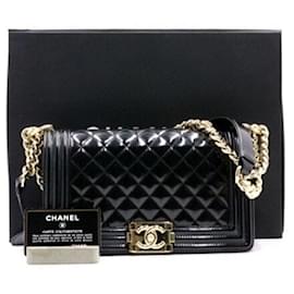 Chanel Borsa a tracolla Boy Medium in pelle caviar nera lucida con finiture champagne gold